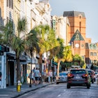 Charleston, USA - May 12, 2018: Downtown district in city with King street in South Carolina with cars and people in southern town shopping and view of Belmond Place hotel